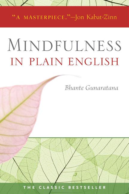 "Book cover of Mindfulness in Plain English by Bhante Gunaratana, featuring a soft pink leaf curving across white background, green leaf-vein pattern at bottom, red top band with 'A MASTERPIECE' quote from Jon Kabat-Zinn, gray title text, and 'THE CLASSIC BESTSELLER' label—timeless vipassana meditation guide in clear language